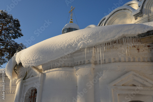 The snow-covered roof of the church
