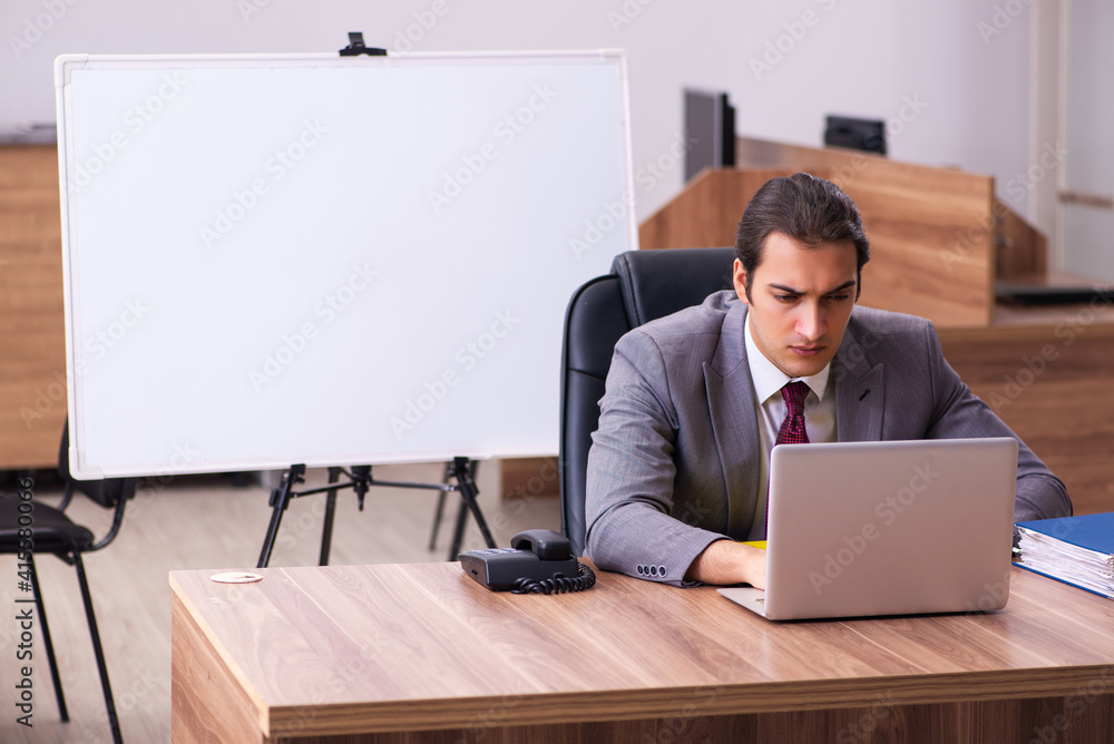 Young male business trainer in the office during pandemic Young male business trainer in the office during pandemic