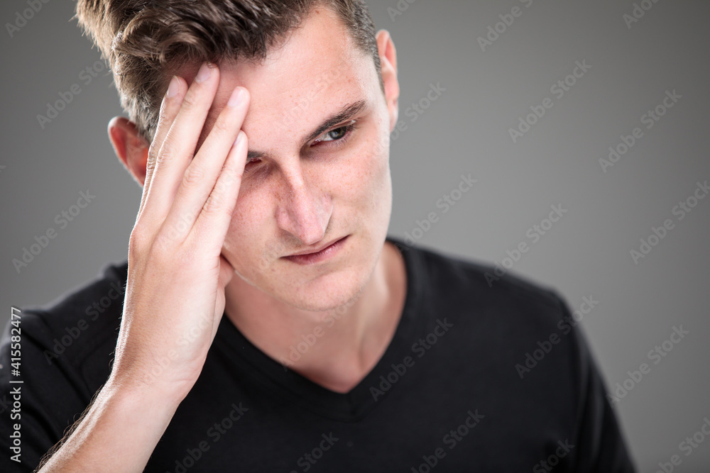 Fear/anxiety/regret/uncertainty in a young man - effects of a difficult life situation - vivid emotions concept Fear/anxiety/regret/uncertainty in a young man - effects of a difficult life situation - vivid emotions concept