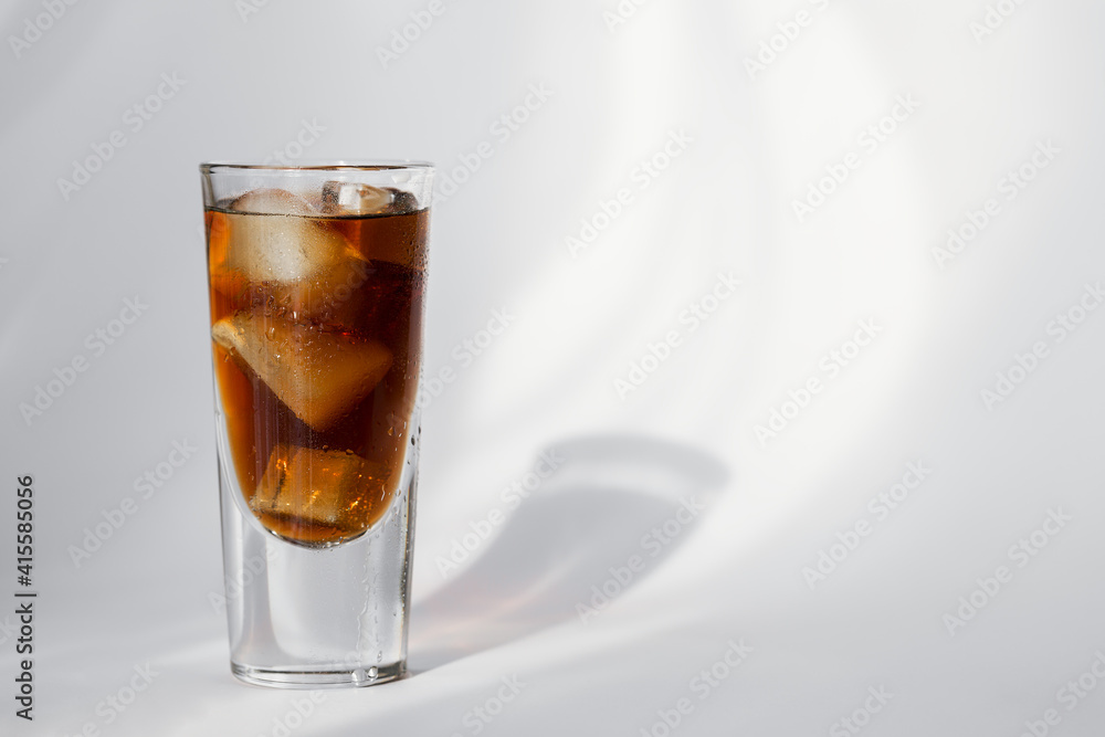 Glass of cola with ice on a white background Glass of cola with ice on a white background