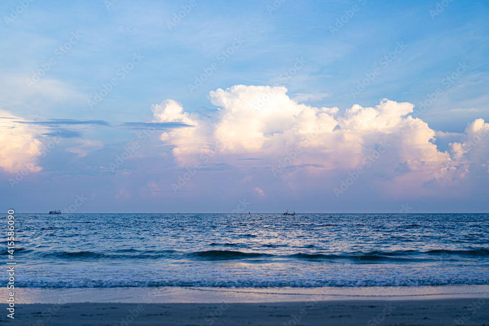 Obraz premium Huahin sea and sky line at the evening with fisherman boat nearby Khao Takiab beach mountain