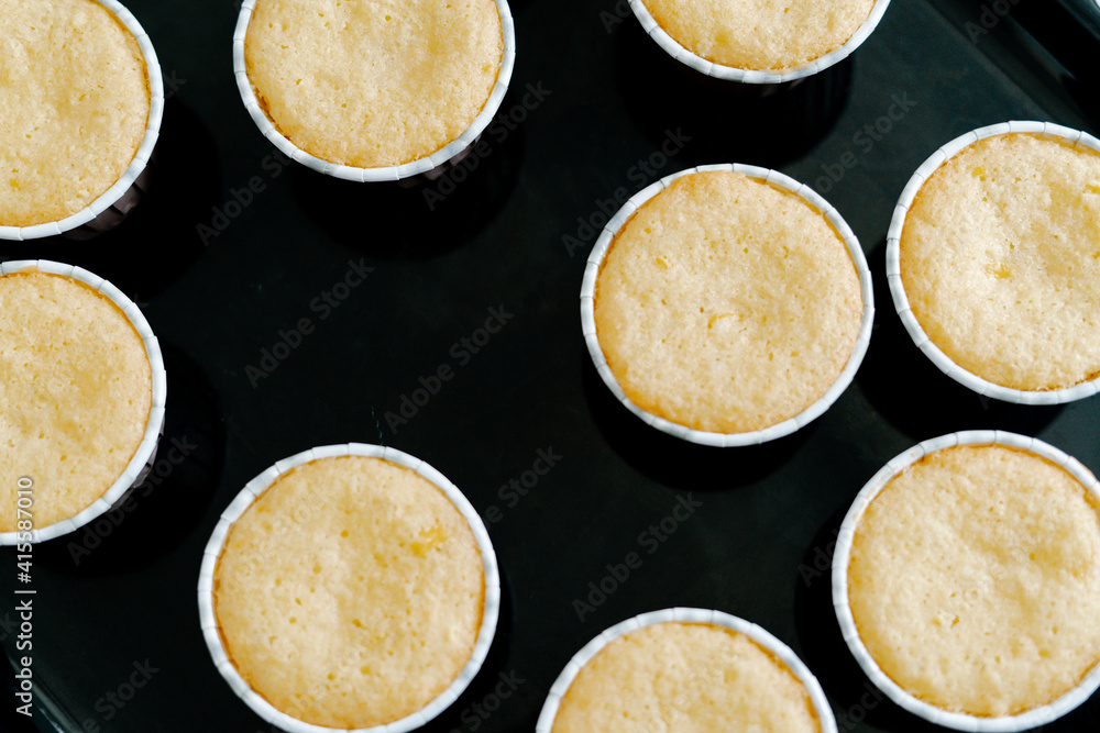 freshly baked cupcakes on a black protvin background.Food for breakfast. Freshly baked cupcakes for dessert. Foodies and cuisine. freshly baked cupcakes on a black protvin background.Food for breakfast. Freshly baked cupcakes for dessert. Foodies and cuisine.