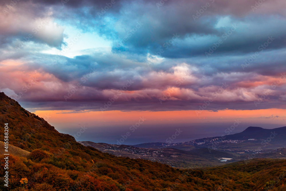 sunset over the hills and the sea in crimea on an autumn evening