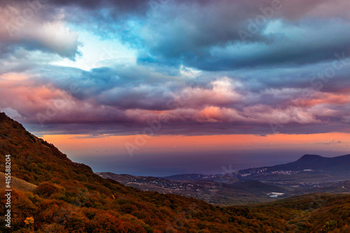 sunset over the hills and the sea in crimea on an autumn evening © Alx_Yago