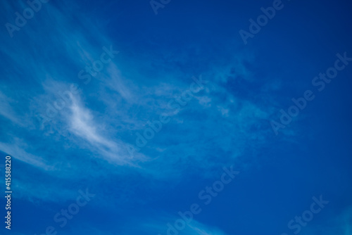 Dramatic clouds on blue sky. Horizontal landscape shot.