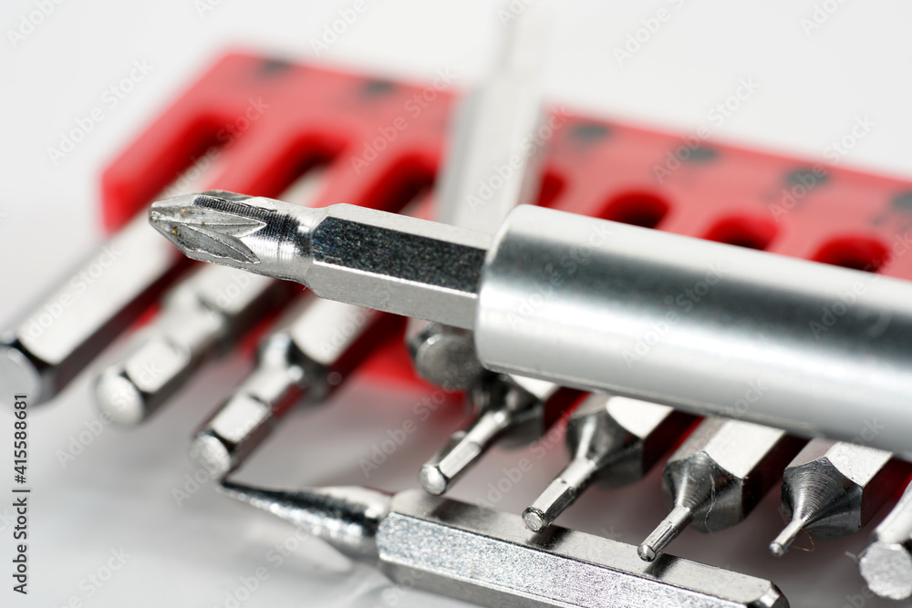 Fototapeta premium Screwdriver bits made from tool steel in the red box photographed against a white background in the studio
