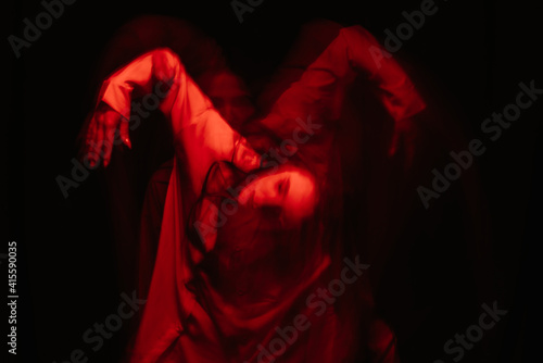 scary portrait of a ghost girl in a white shirt with a blur