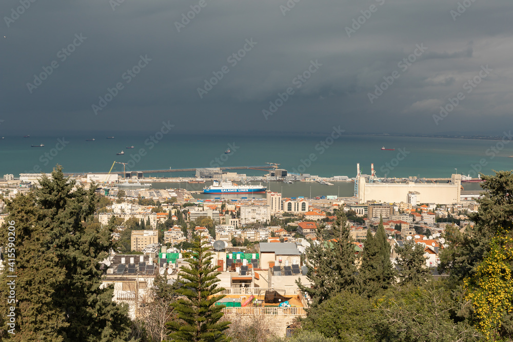 View on a rainy day from Mount Carmel to the downtown, the port and the Mediterranean Sea and Haifa city, in Israel.