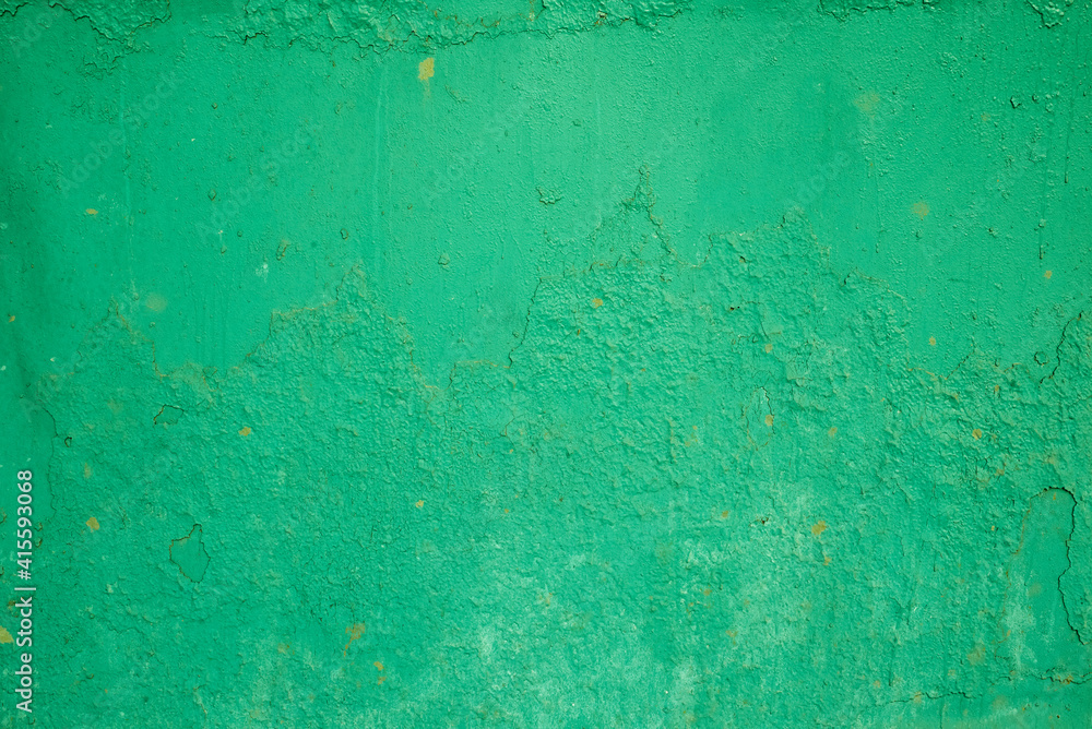 the texture of an old green painted wall. rough background.