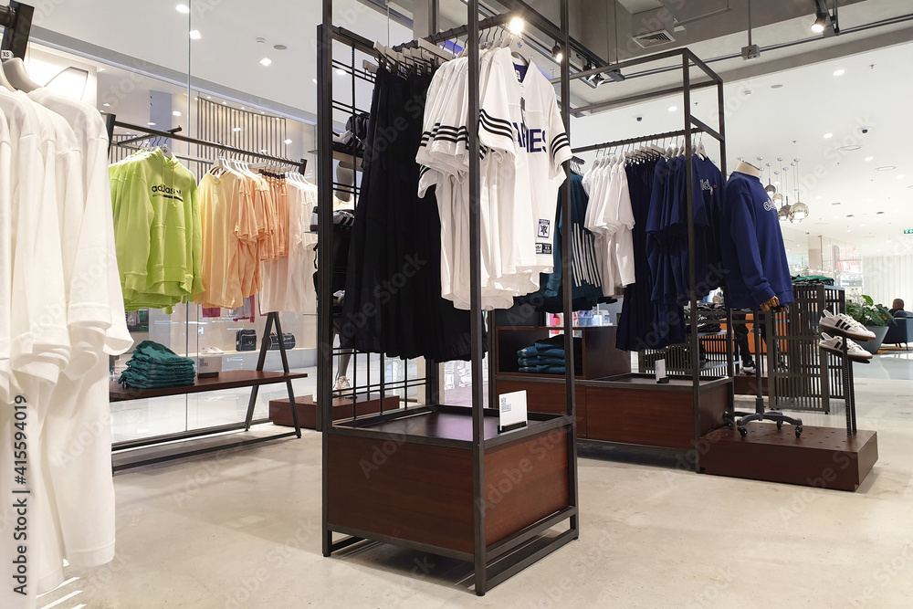 Interior view of Adidas retail store in ICONSIAM Mall, Bangkok. Adidas is a  German corporation that designs footwear and clothing. BANGKOK, THAILAND -  APR 5, 2019. Stock Photo | Adobe Stock