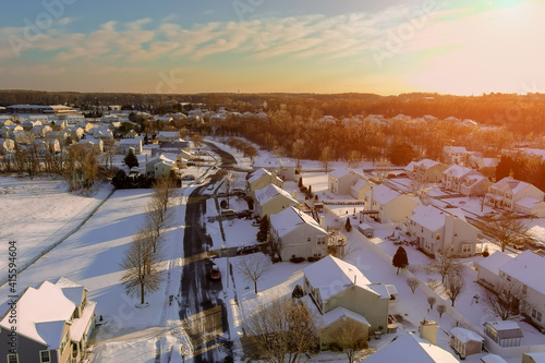 America peaceful cold snowy day amazing winter landscape sunset scenery in residential streets of a small town after the snowy time