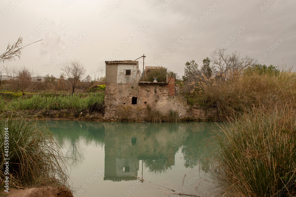 abandoned house in ruins by the river