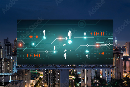 Canvas Print Glowing Social media icons on billboard over night panoramic city view of Kuala Lumpur, Malaysia, Asia