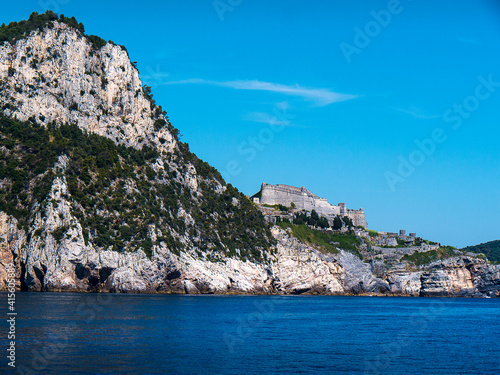 Walled town and harbour of Porto Venere on the coastline in Liguria Italy. The 5 Cinque Terra fishing villages can be reached from here photo