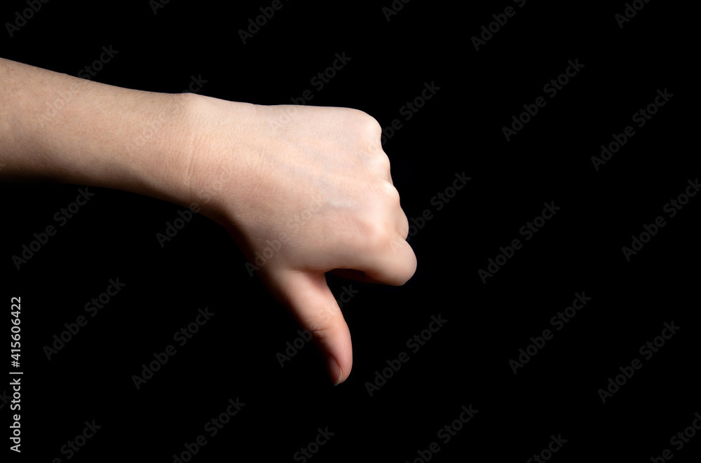 Thumb down sign hand gesture on dark black background, Review, business, sign, negative,bad concept Thumb down sign hand gesture on dark black background, Review, business, sign, negative,bad concept
