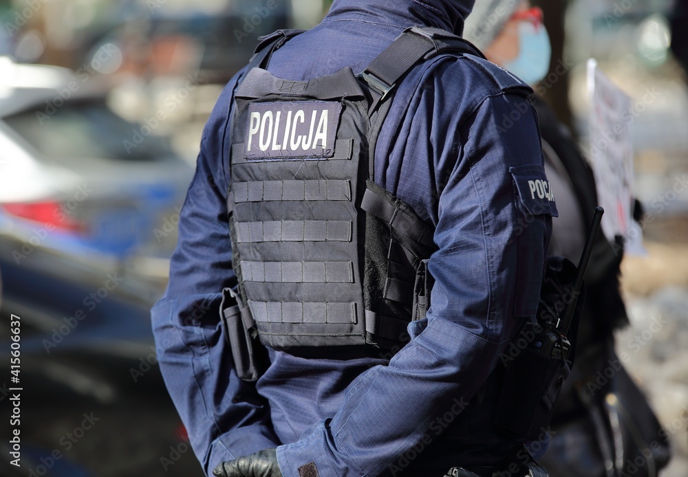 policeman in uniform on the street policeman in uniform on the street
