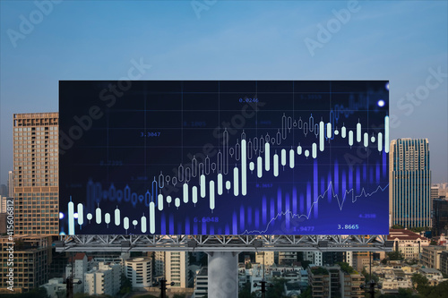 Glowing FOREX graph hologram on billboard, aerial panoramic cityscape of Bangkok at sunset. Stock and bond trading in Southeast Asia. The concept of fund management. photo