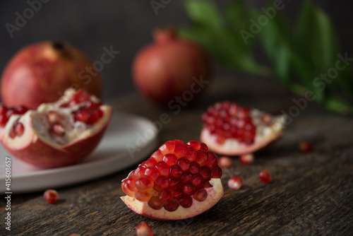 Fresh ripe pomegranate on a wooden background