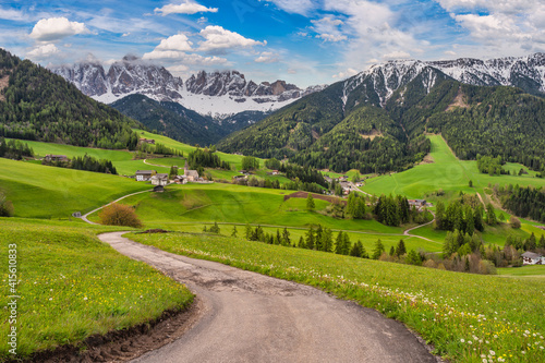 Dolomites Alps mountain landscape at Santa Maddalena village with walk path in spring season, St. Magdalena Italy