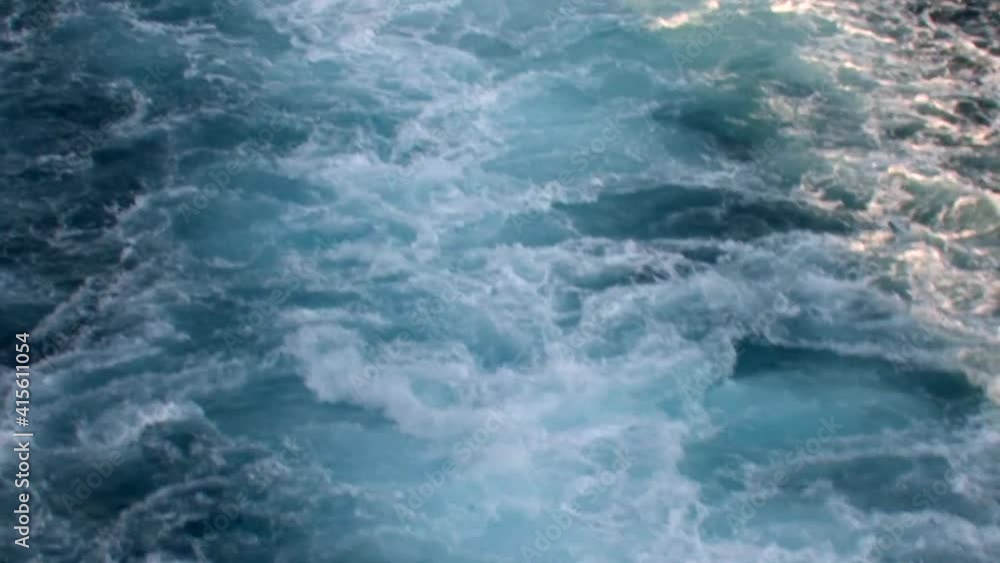 the waves left behind by a large ship as it travels in the Aegean Sea the waves left behind by a large ship as it travels in the Aegean Sea