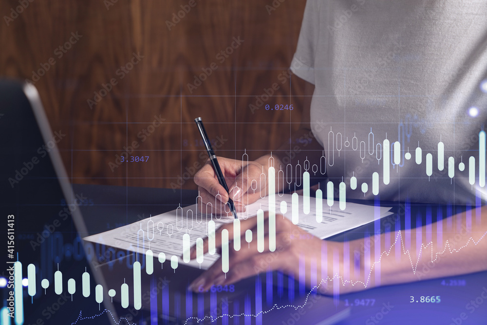 A client in casual wear is signing the contract to invest money in stock market. Internet trading and wealth management. Forex and financial hologram chart over the desk. Women in business concept. A client in casual wear is signing the contract to invest money in stock market. Internet trading and wealth management. Forex and financial hologram chart over the desk. Women in business concept.