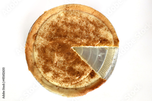 Traditional South African milk tart slice isolated on white background