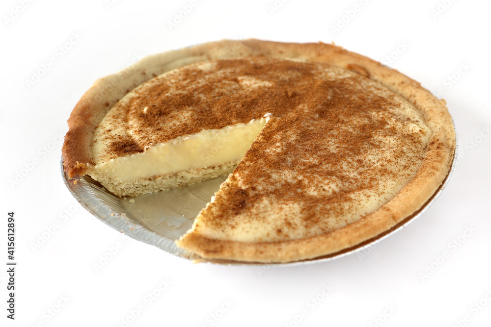 Traditional South African milk tart slice isolated on white background