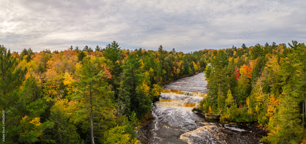 Autumn colors of Lower Tahquamenon Falls basin in Tahquamenon State Park in the Michigan Upper Peninsula - waterfall