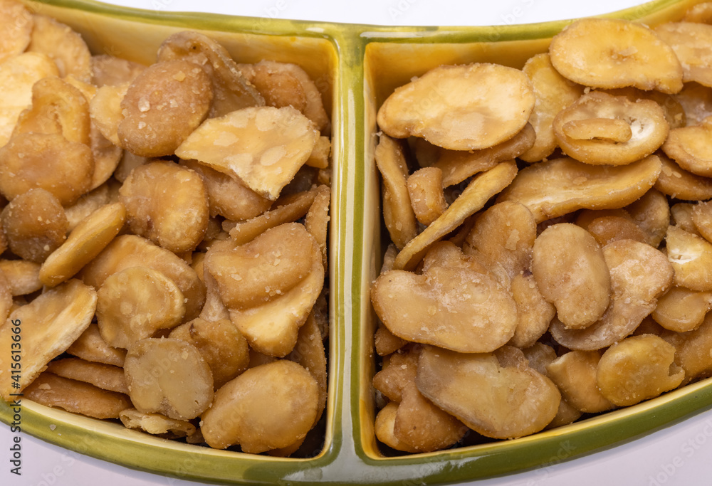Roasted and salted fava beans for a healthy vegan and vegetarian diet snack. High in protein, vitamins, dietary fibre and nutrients Roasted and salted fava beans for a healthy vegan and vegetarian diet snack. High in protein, vitamins, dietary fibre and nutrients