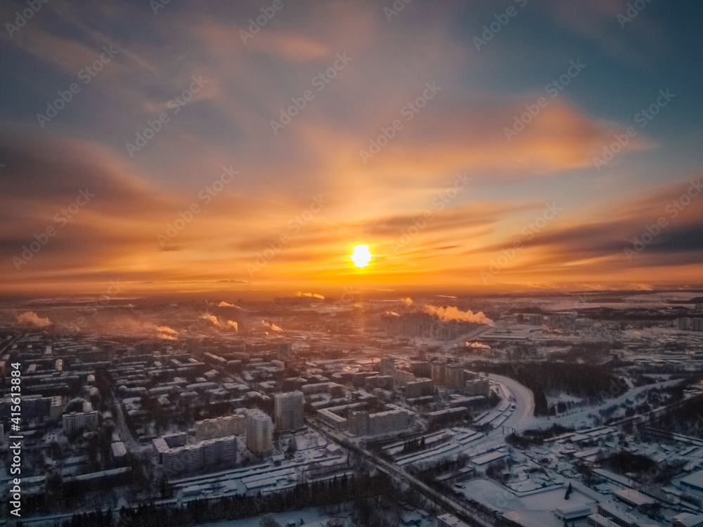rising sun illuminates the beautiful home town shackled by frost