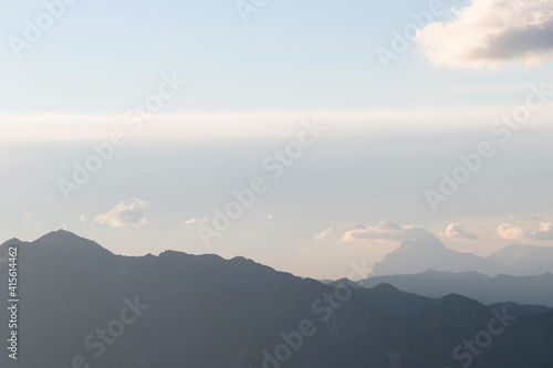 Panorama of the mountain range in the distance. Landscape in soft blue tones 
