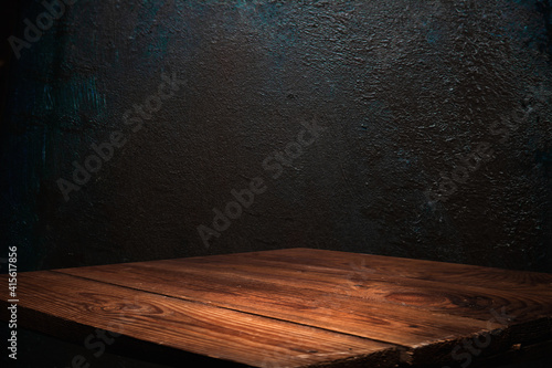 dark background wall with empty table for product display
