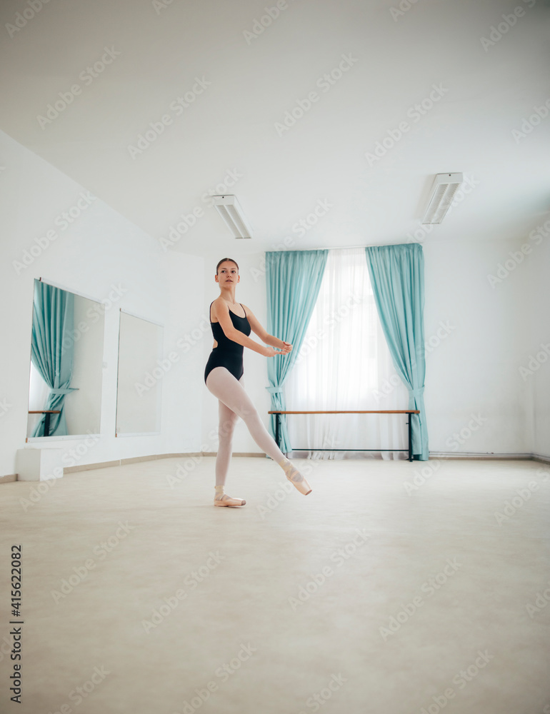 Ballerina dancing in ballet studio
