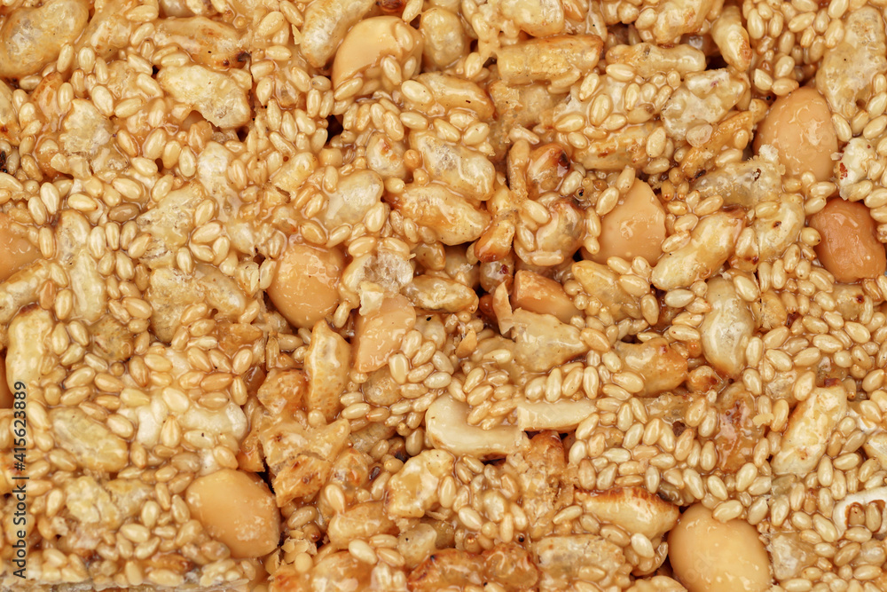 Krayasart, Thai dessert made of rice, nut, sesame-seeds and sugar.Use for background.
Krayasart, Thai dessert made of rice, nut, sesame-seeds and sugar.Use for background.