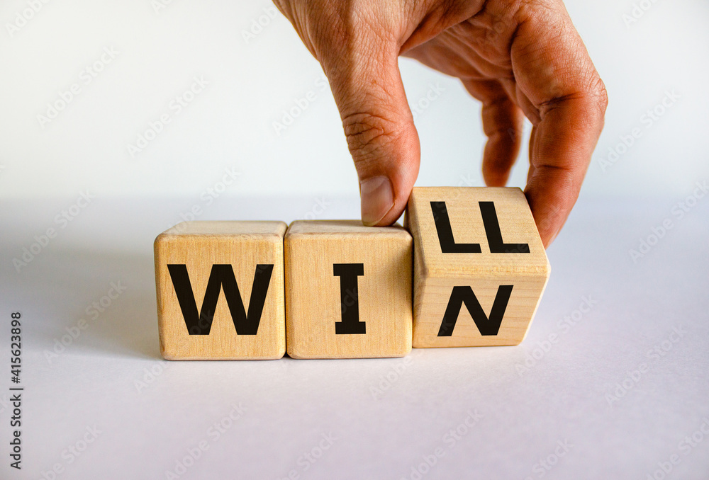 Naklejka premium We will win symbol. Businessman turns cubes and changes the word will to win. Beautiful white background, copy space. Business, motivational and we will win concept.