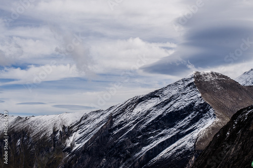 alp mountains with snow and clouds