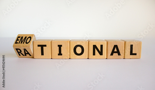 Rational or emotional symbol. Turned wooden cubes and changed the word 'rational' to 'emotional'. Beautiful white background. Psychological and rational or emotional concept. Copy space.