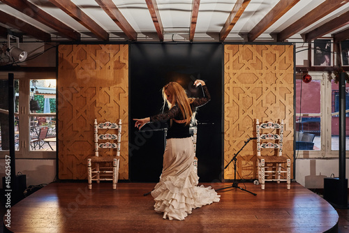 Spanish flamenco dancer on a traditional stage.