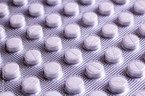 packaging of white small tablets close-up. selected focus
