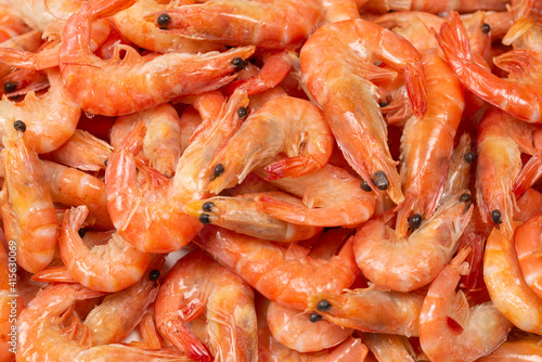 Shrimps background texture. A lot of shrimps. Cooked shrimps.