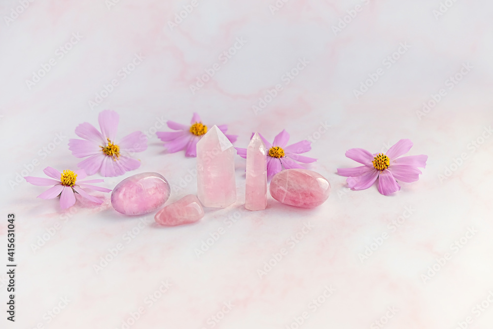 pink quartz minerals and pink flowers. Healing minerals for Chakra Relaxation, Wiccan Witchcraft. life balance, esoteric, spiritual practice concept pink quartz minerals and pink flowers. Healing minerals for Chakra Relaxation, Wiccan Witchcraft. life balance, esoteric, spiritual practice concept