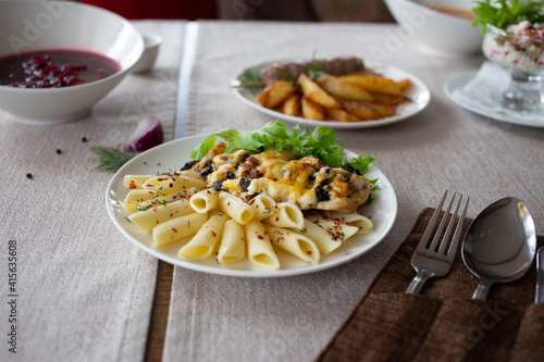 Pasta with chicken breast with cheese and mushrooms