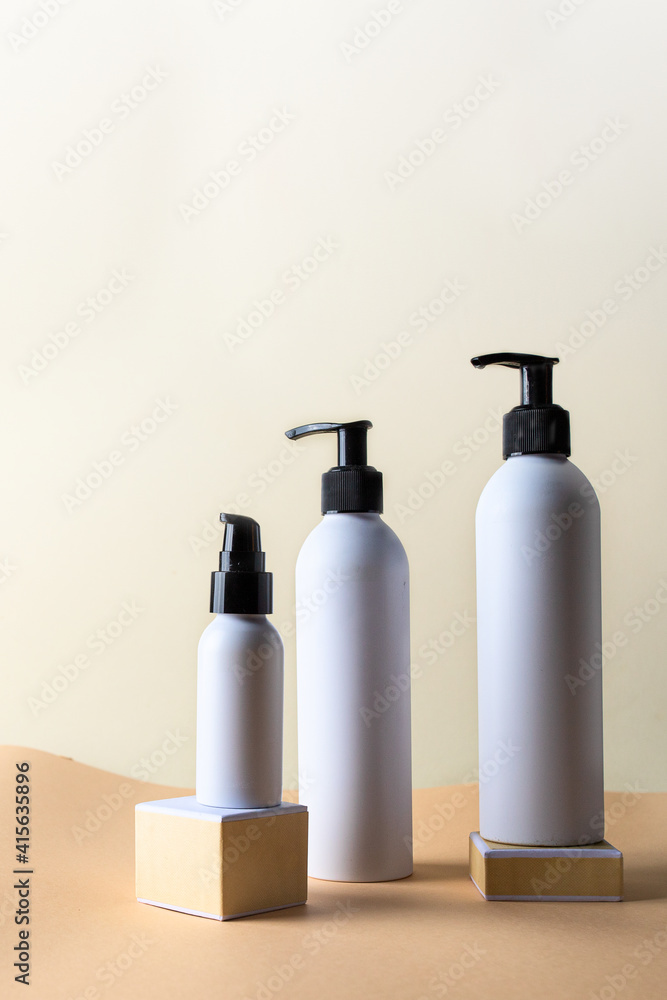 White cosmetic bottles on podium with green plant. Abstract background for cosmetic product presentation and branding. Natural product for skin care concept. White cosmetic bottles on podium with green plant. Abstract background for cosmetic product presentation and branding. Natural product for skin care concept.