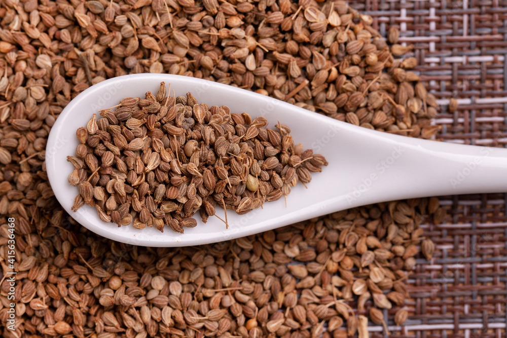 Anise seeds in a wooden spoon. Spice. Lots of dry anise seeds. Anise seeds in a wooden spoon. Spice. Lots of dry anise seeds.