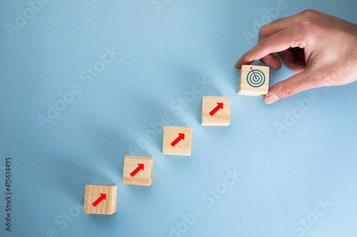 man holding cubes and target