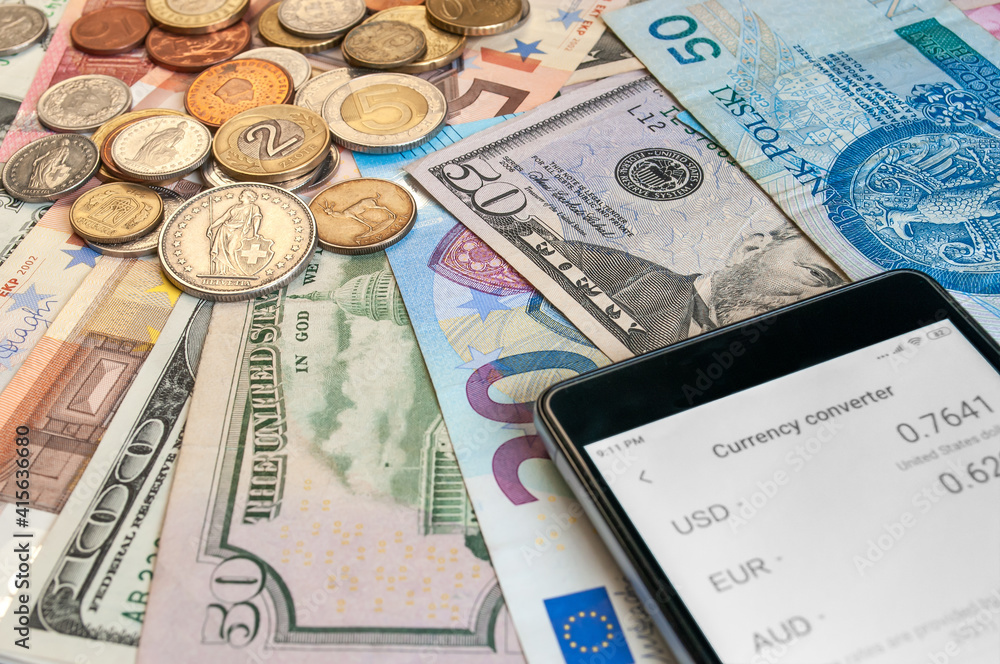 close up image of credit card, smartphone, coins and banknotes of different currencies close up image of credit card, smartphone, coins and banknotes of different currencies