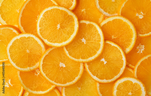 Abstract background of orange citrus slices on white.