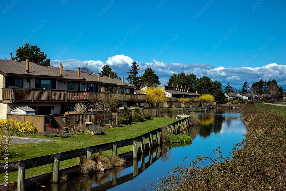 Residential area in a picturesque place against the blue cloudy sky