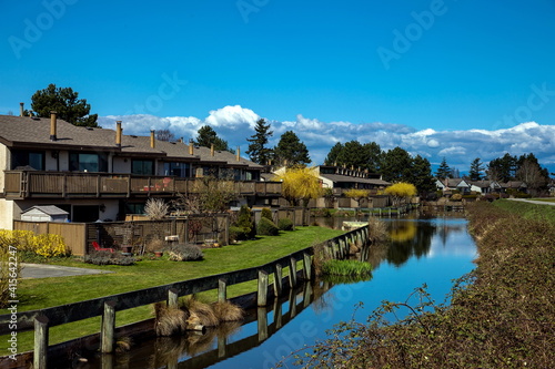 Residential area in a picturesque place against the blue cloudy sky