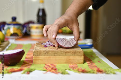 Closeup shot of a person cutting an onion photo